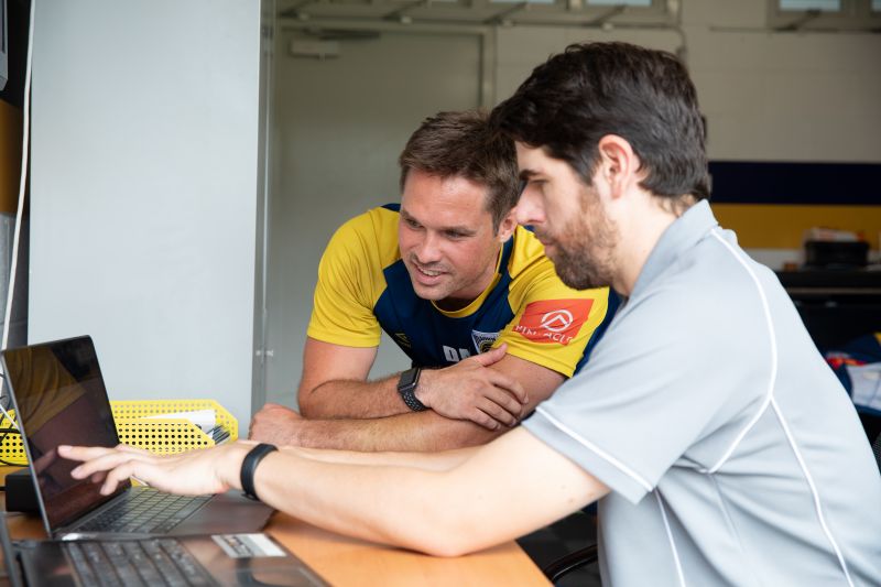 Two men working at a desk